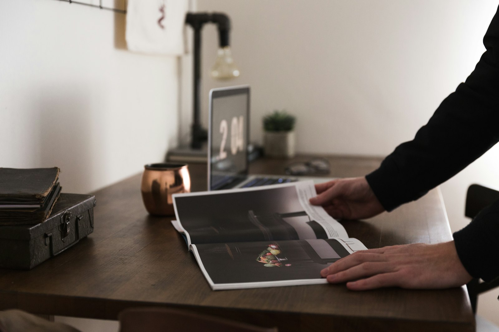 Designer reviewing printed proofs on a table