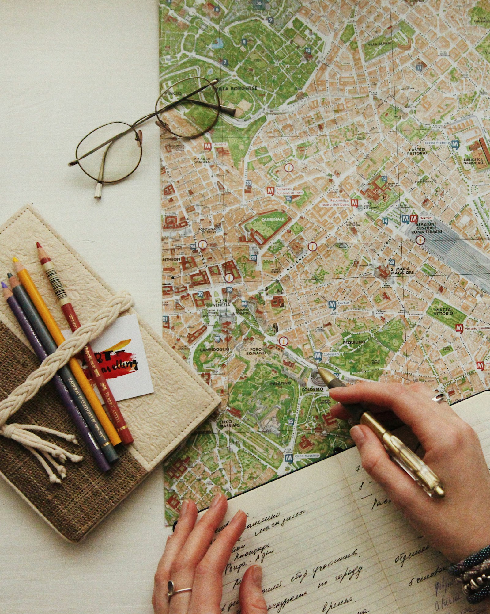 Overhead view of a travel-planning map on a desk